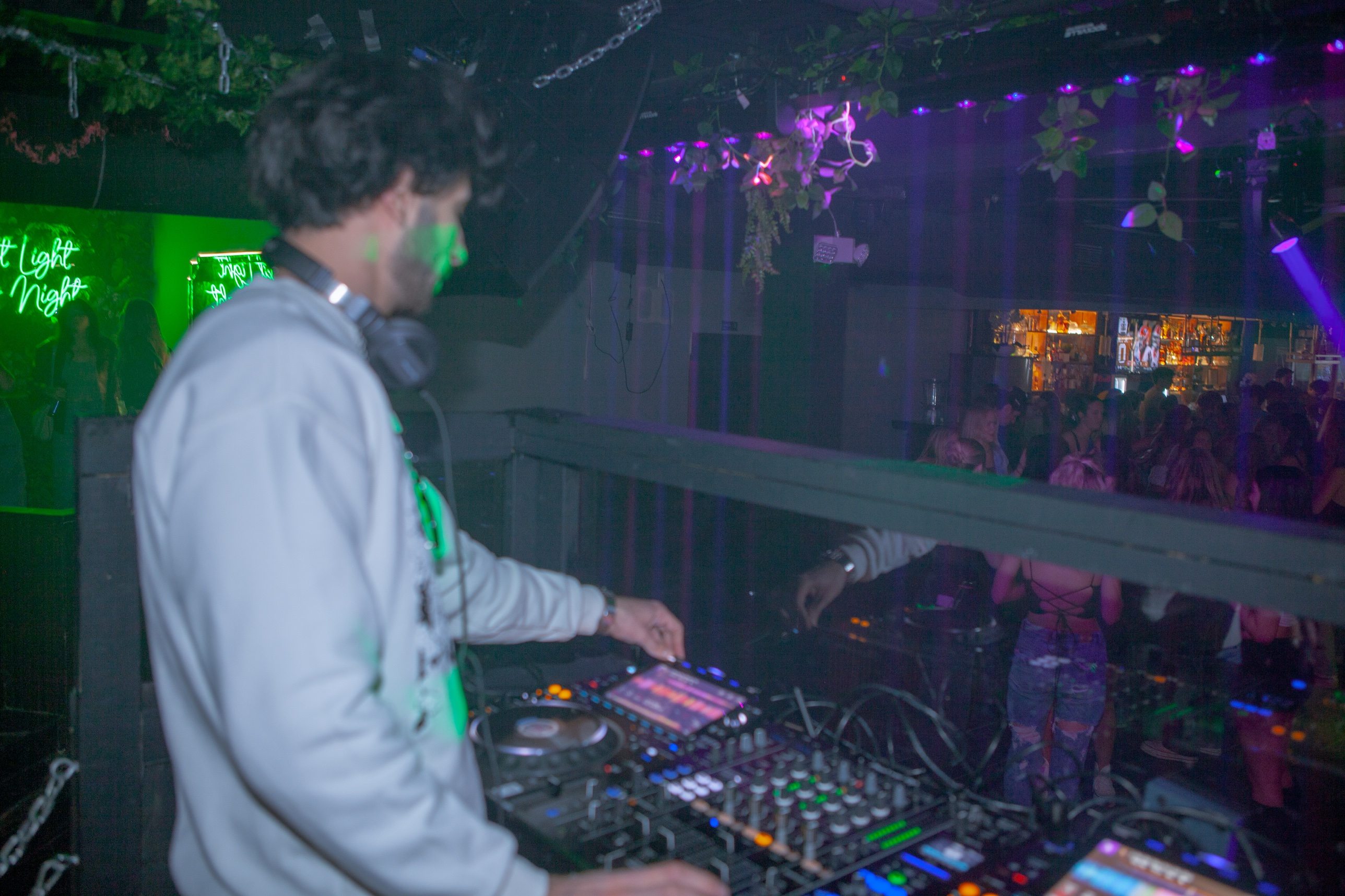 Jozan playing to the crowd, green and purple light