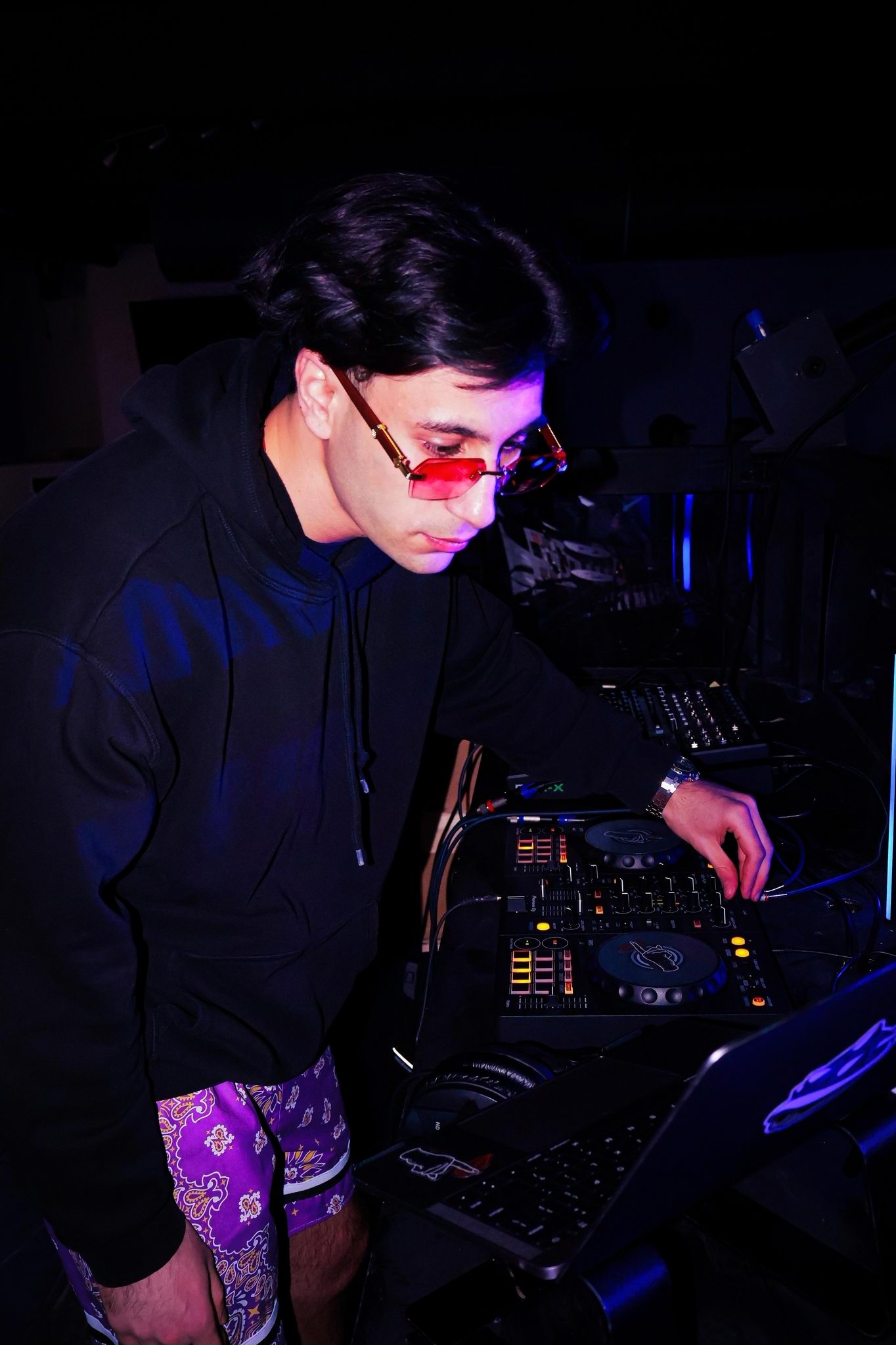 Jozan in the booth under blue light